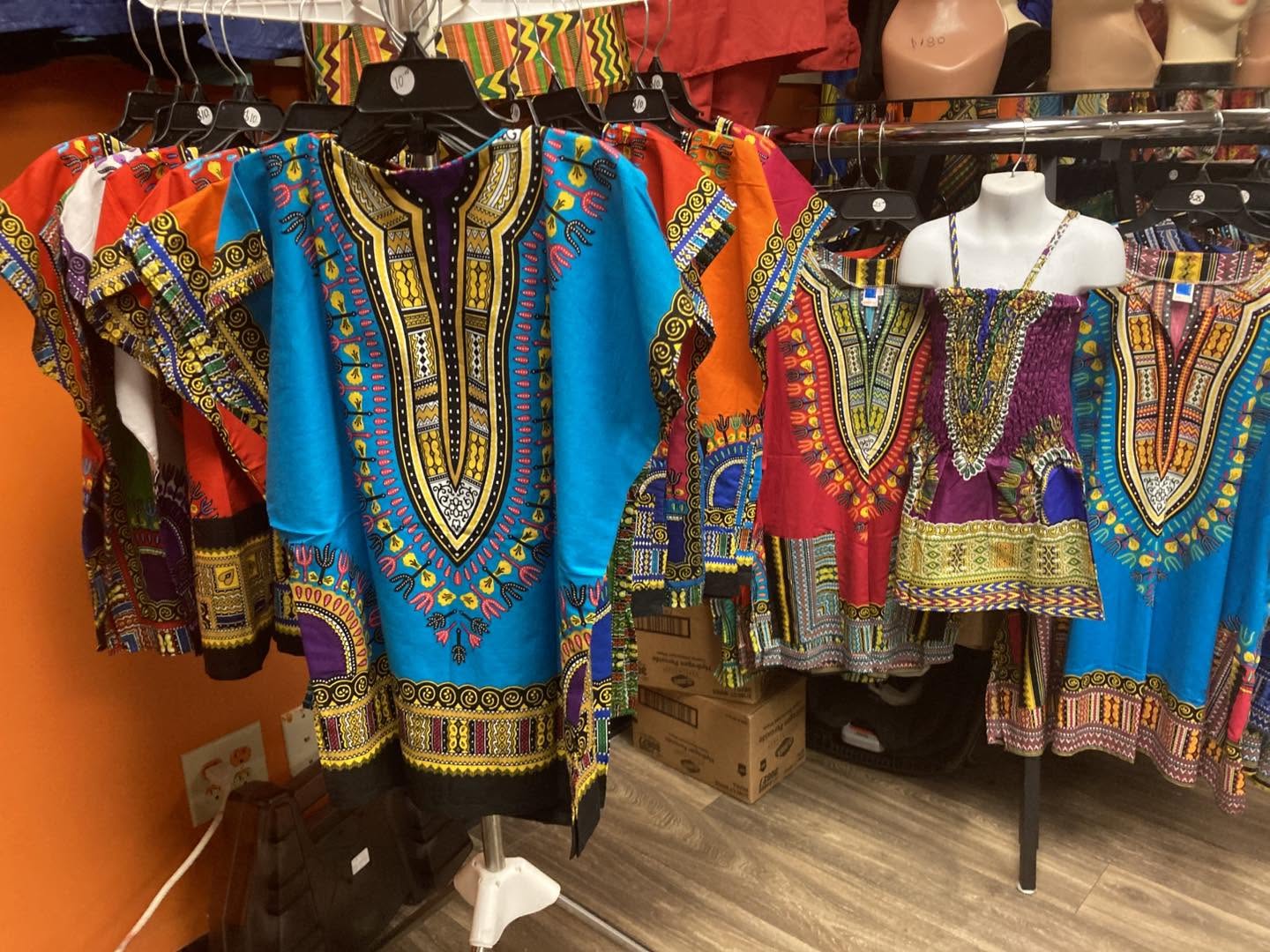 Racks of colorful African-print dashikis in the Grace boutique