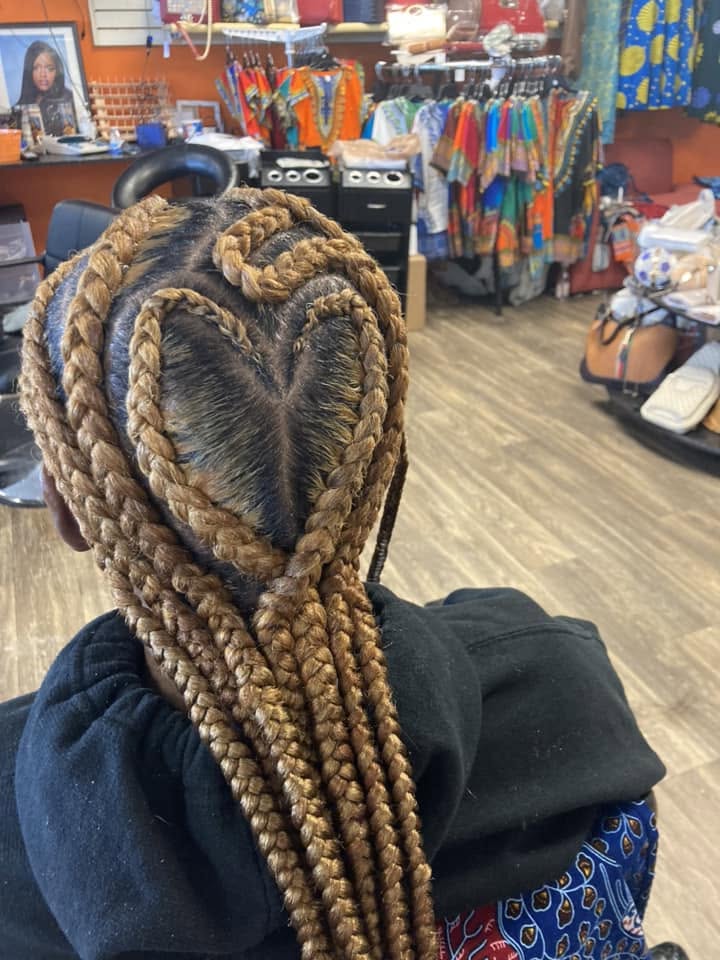 Feed-in cornrows styled in a heart design